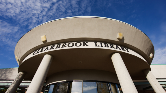 Clearbrook Library's front entrance captured in an exterior photo, highlighting its inviting architecture and entryway.
