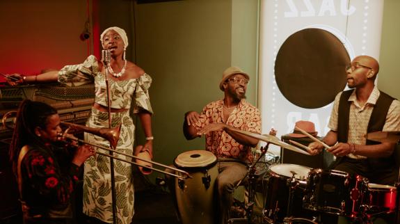 A dynamic group of people playing instruments in a jazz club, showcasing talent and energy.