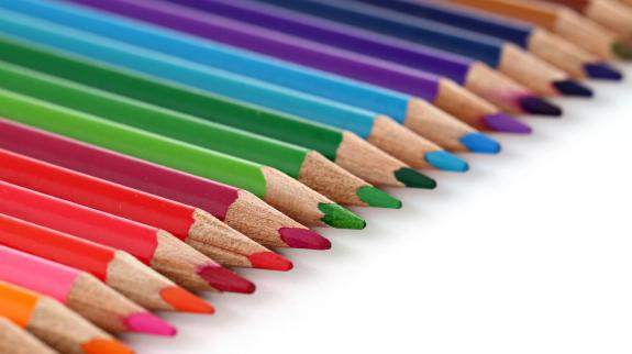 A lineup of coloured pencils.