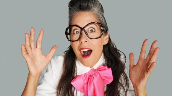 Dr. Professor with her hands in the air.