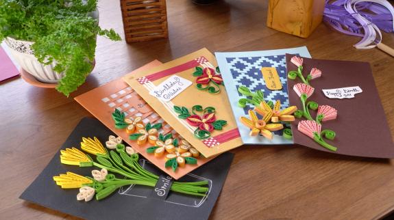 DIYed assortment of greeting cards made with paper quilling.
