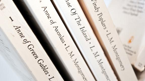 Anne of Green Gables, by Lucy Maud Montgomery first four books of the fictional series are displayed.