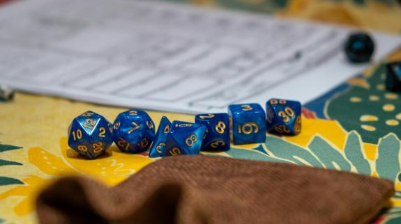 A close up of a Dungeons & Dragons game board and dice.