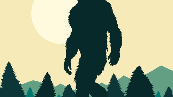 A sasquatch-like figure in a forest setting.