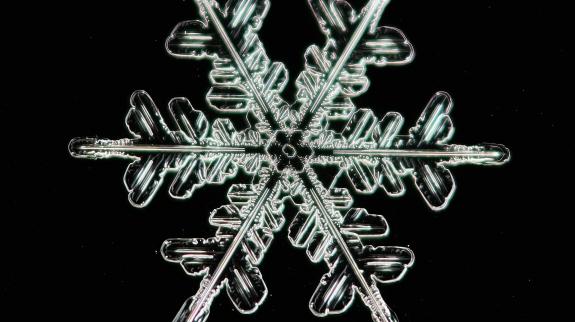 Snowflake on black background.