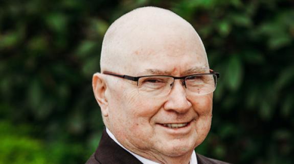Headshot of author Raymond Maher.