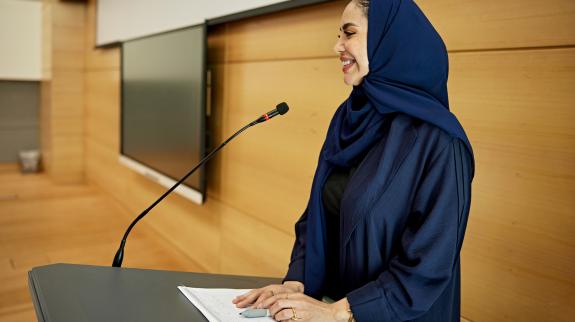 Female professor gives a lecture.