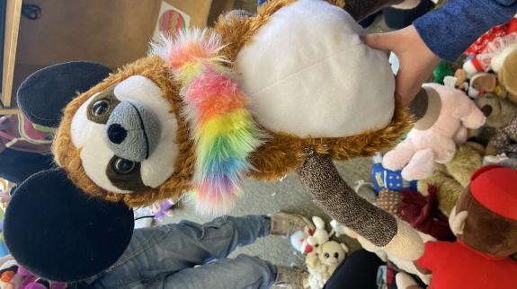 A stuffed animal made of various pieces from other stuffed animals