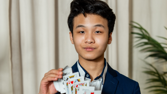 Blake Aleong doing a card trick