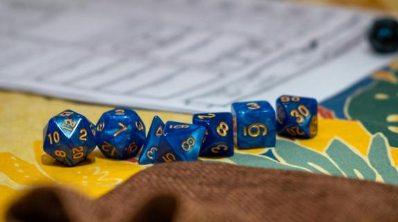 A close up of a Dungeons & Dragons game board and dice.