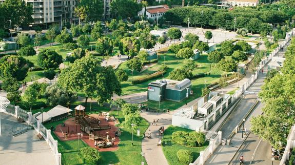 A landscape of a park and city.