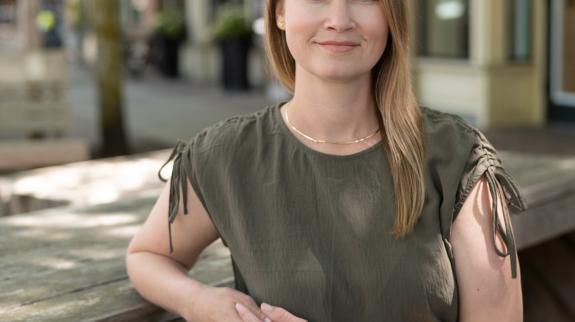 Author Megan Carey seated outdoors.