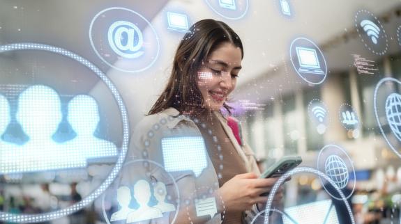 Young woman using mobile phone with augmented reality.