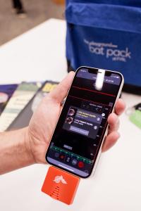 A bat detector is being used with a mobile device.
