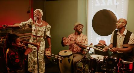 A dynamic group of people playing instruments in a jazz club, showcasing talent and energy.