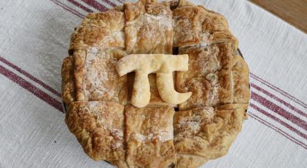 A freshly baked pie with the mathematical pie symbol in celebration of Pi Day on March 14.