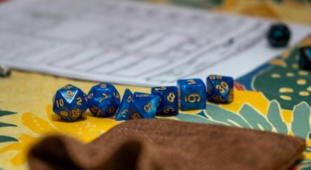 A close up of a Dungeons & Dragons game board and dice.