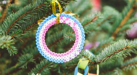 Handmade fuse beads wreath decoration on Christmas tree.