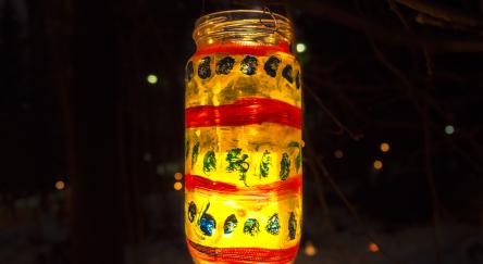 Hand decorated and painted holiday mason jar lantern.