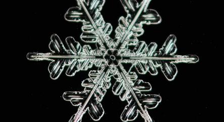 Snowflake on black background.