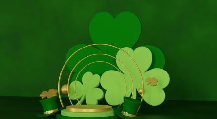 Green clovers on a gold and green platform with small green top hats.