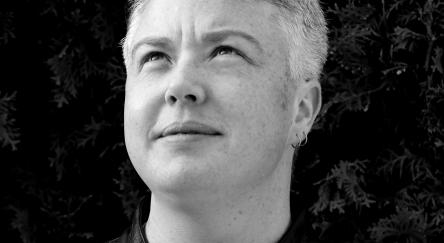 Black and white headshot of author Loghan Paylor.