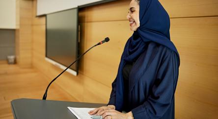 Female professor gives a lecture.