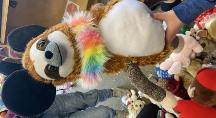 A stuffed animal made of various pieces from other stuffed animals