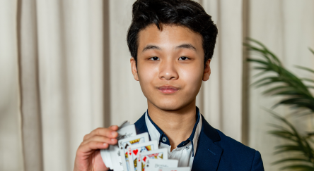 Blake Aleong doing a card trick