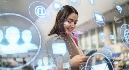 Young woman using mobile phone with augmented reality.