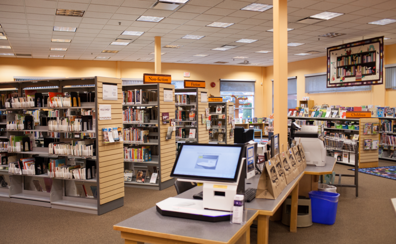 Interior of Hope Library featuring a self-checkout kiosk for easy book borrowing.