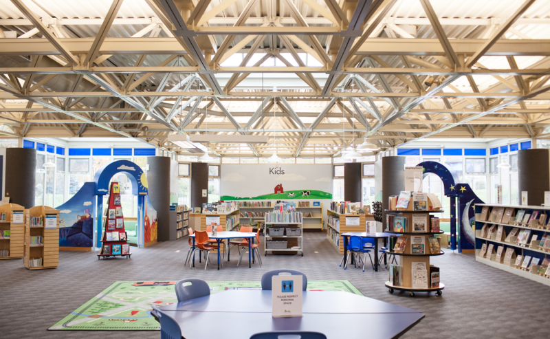 Chilliwack Library interior showcasing tables and chairs for patrons to read and study comfortably.