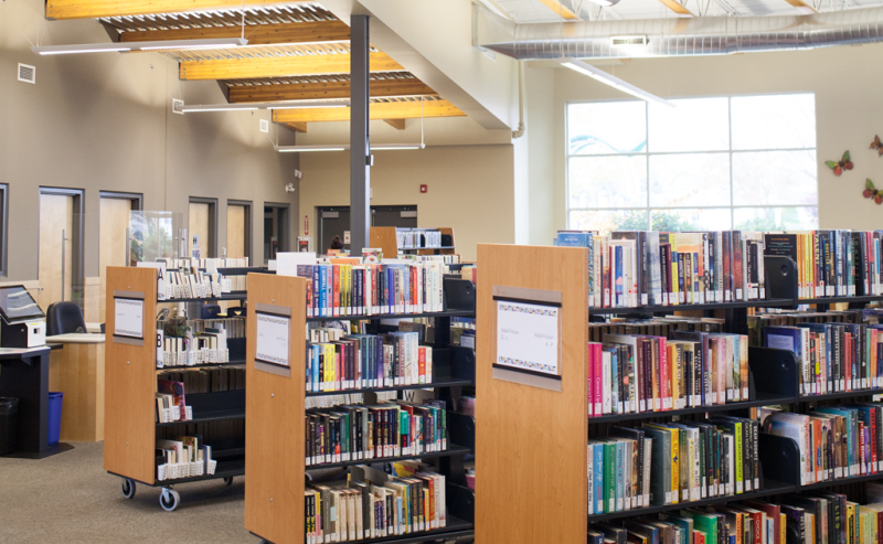  Inside Sardis Library, shelves are lined with an extensive collection of books, creating a cozy reading atmosphere.