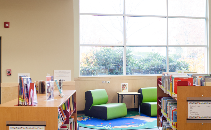 A spacious window in the Sardis Library, enhancing the interior with warm, natural light for a cozy atmosphere.