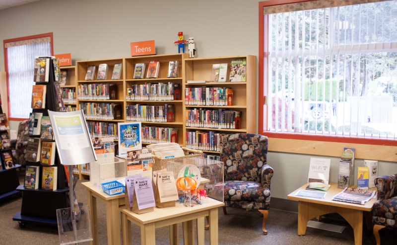 The well-stocked bookcases showcasing a collection of books inside Yarrow Library.