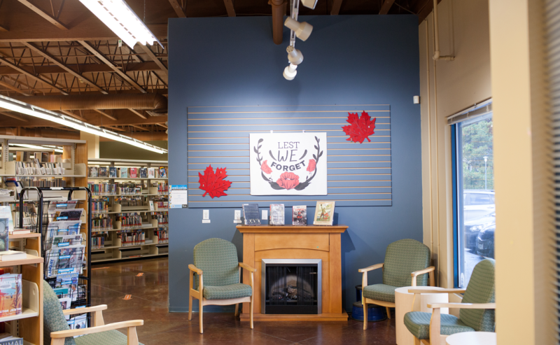 Murrayvile Library's interior with a charming fireplace, providing a cozy space for visitors to enjoy books and relaxation.