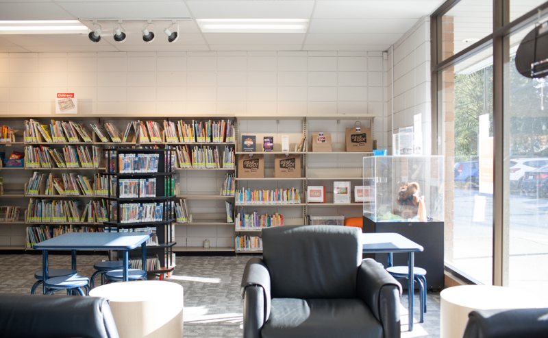 Interior of Brookswood Library filled with shelves of books, creating a cozy and inviting reading atmosphere.