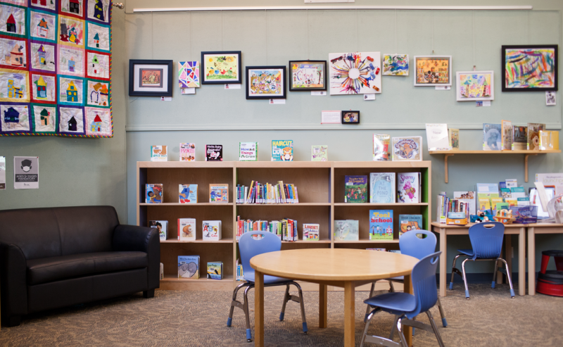 White Rock Library's children's area with a table and chairs, creating a welcoming space for reading and play..
