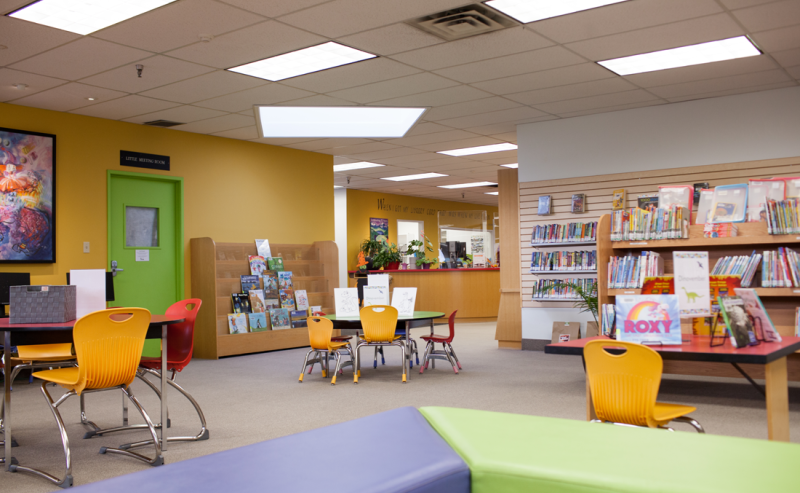 Interior view of Tsawwassen Library, highlighting a room filled with bright colors and cheerful design.