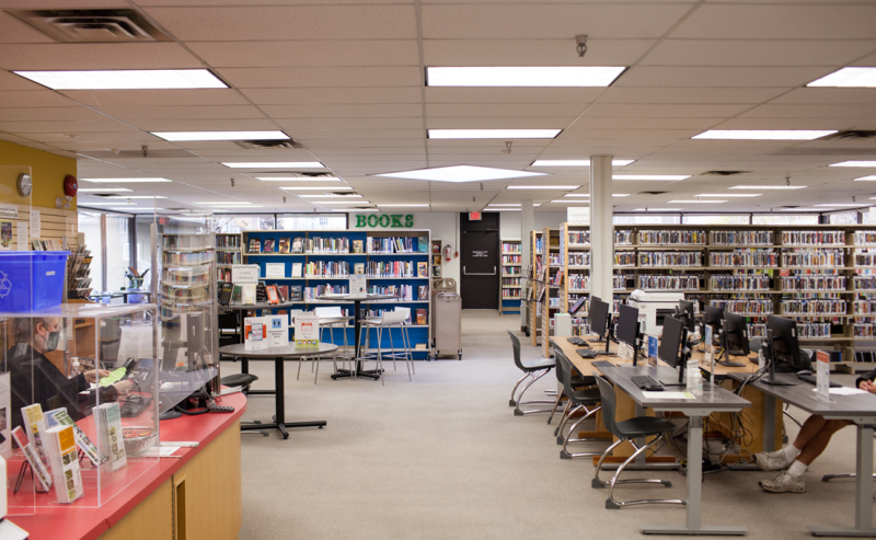 Interior view of Tsawwassen Library featuring a bright white ceiling that enhances the space's openness.