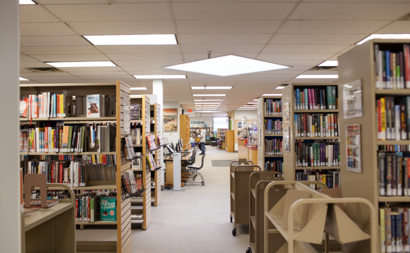 A view of the Tsawwassen Library's interior, featuring shelves filled with various books.