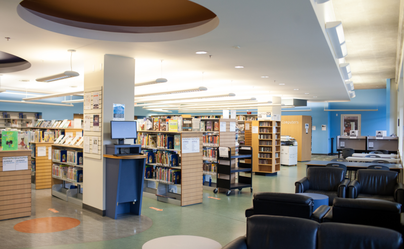 Circular ceiling design in the interior of Muriel Arnason Library, showcasing architectural elegance and spaciousness.