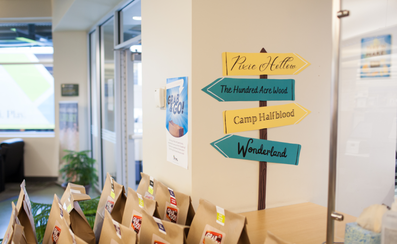 A table with Grab & Go bags located in the Muriel Arnason Library, enhancing the space's inviting and warm ambiance.