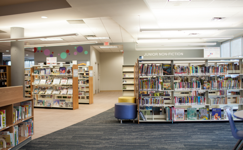 Maple Ridge Public Library's interior features numerous books on shelves, providing a serene space for book lovers.