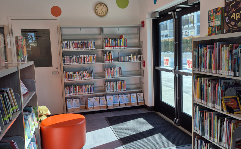 Colorful rug enhances the cozy atmosphere of the Fort Langley Library's interior.