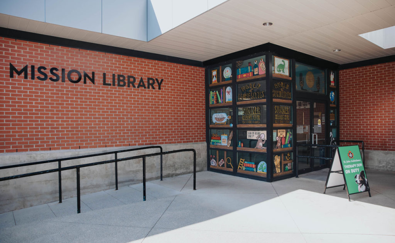 Exterior view of the Mission Library, situated in the vibrant heart of downtown, showcasing its architectural features.