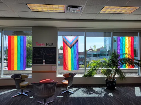 Pride flags hang from the windows at Maple Ridge Public Library.
