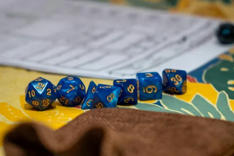A close up of a Dungeons & Dragons game board and dice.