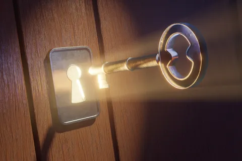 A golden key inserted in a keyhole on a wooden door, emitting bright light, symbolizing discovery or unlocking potential.