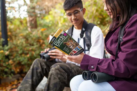 Teens use a Birwatching Backpack from the FVRL Playground™ collection, which includes a birding guide book and binoculars.